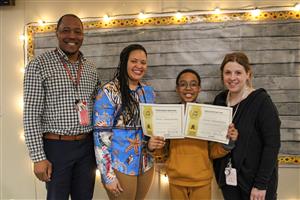 steven holding certificates with teachers